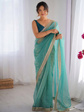 Women's Net Light Blue Embellished Designer Saree With Blouse Piece