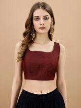Maroon colored sleeveless tafeta blouse