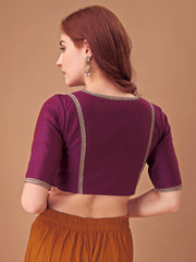 Magenta colored half sleeves tafeta blouse with lace embellishments