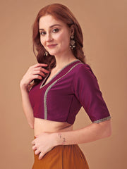 Magenta colored half sleeves tafeta blouse with lace embellishments