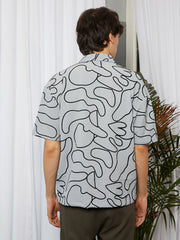 قميص واسع مبطن بنقش تجريدي