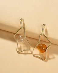 قرط أذن مطلي بالذهب بتصميم متدلي