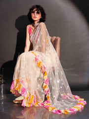 Off white colored net saree with faux mirror embroidery and printed lehariya frill on border