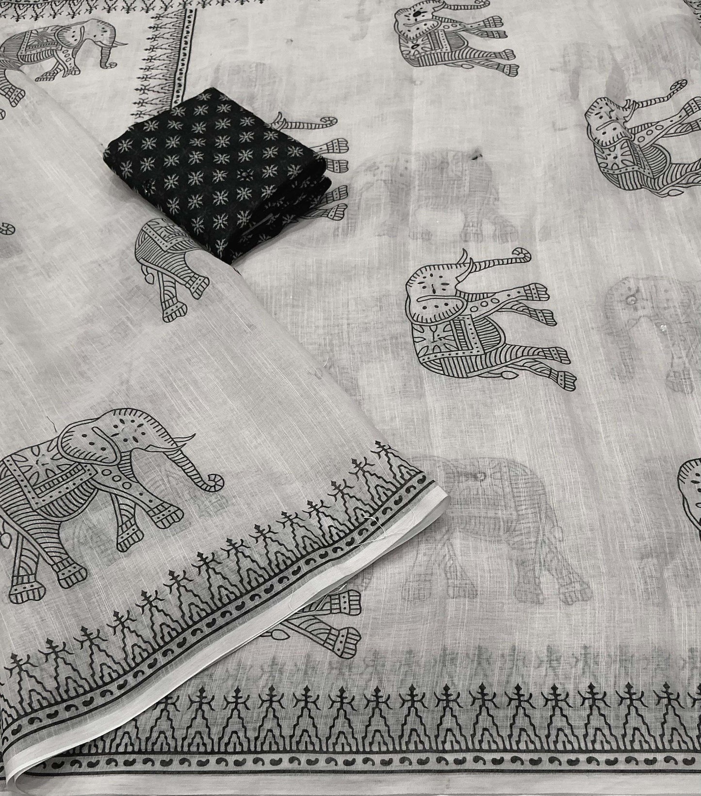 Soft linen saree with shaded style prints.