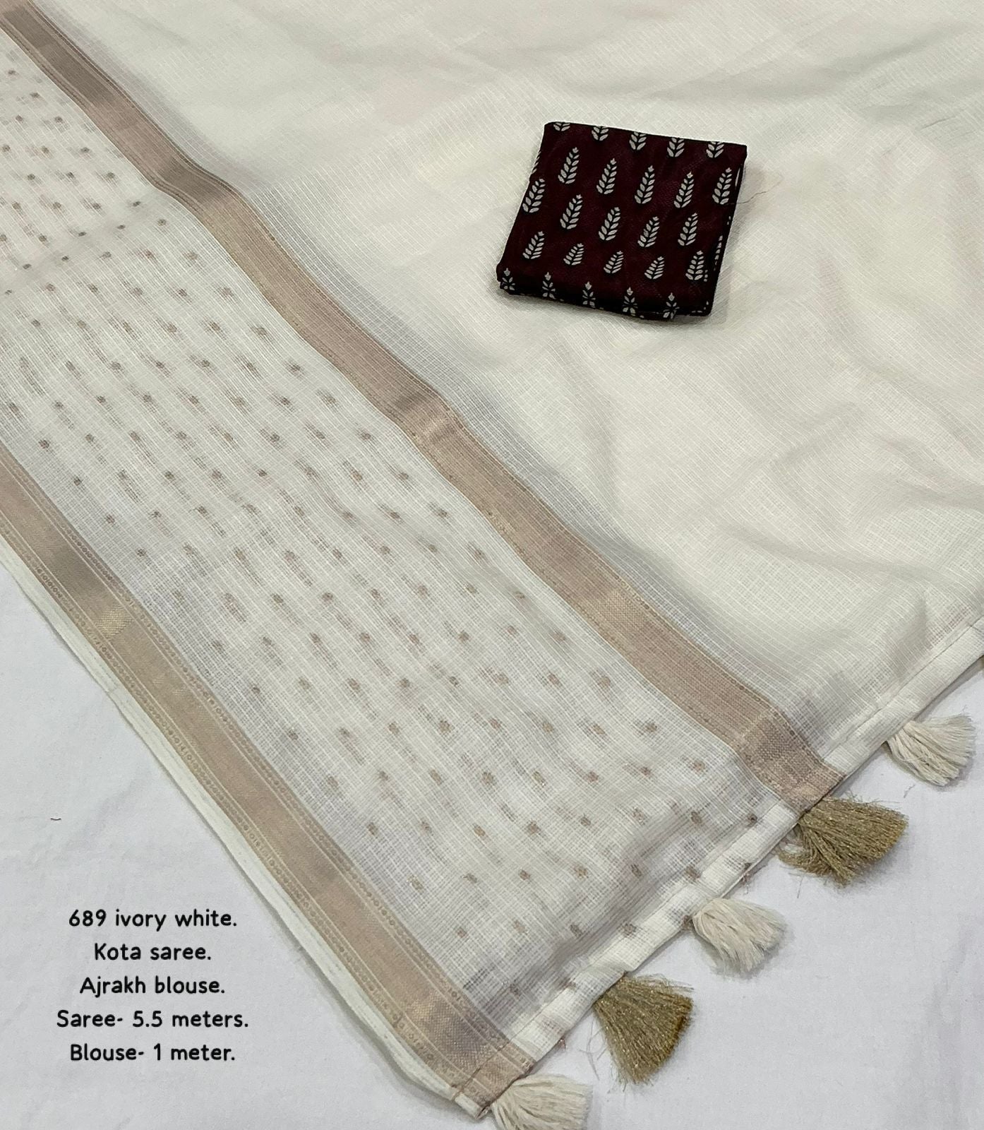 soft kota saree with zari woven zig zag border.cotton tassels on pallu.contrast zari woven banarasi silk blouse