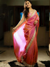 ساري نسائي وردي اللون مزين بتطريزات، مع قطعة بلوزة