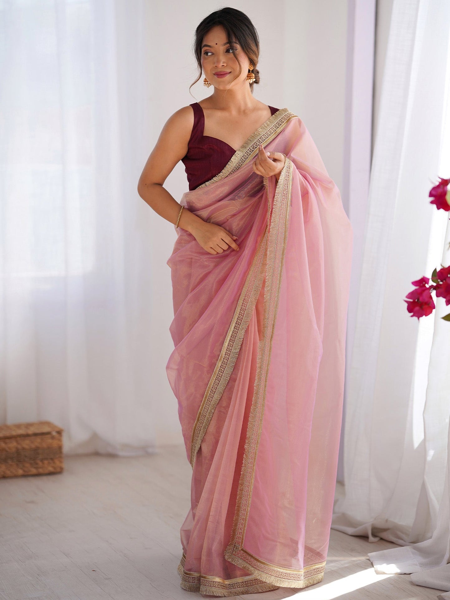 Women's Net Peach Embellished Designer Saree With Blouse Piece