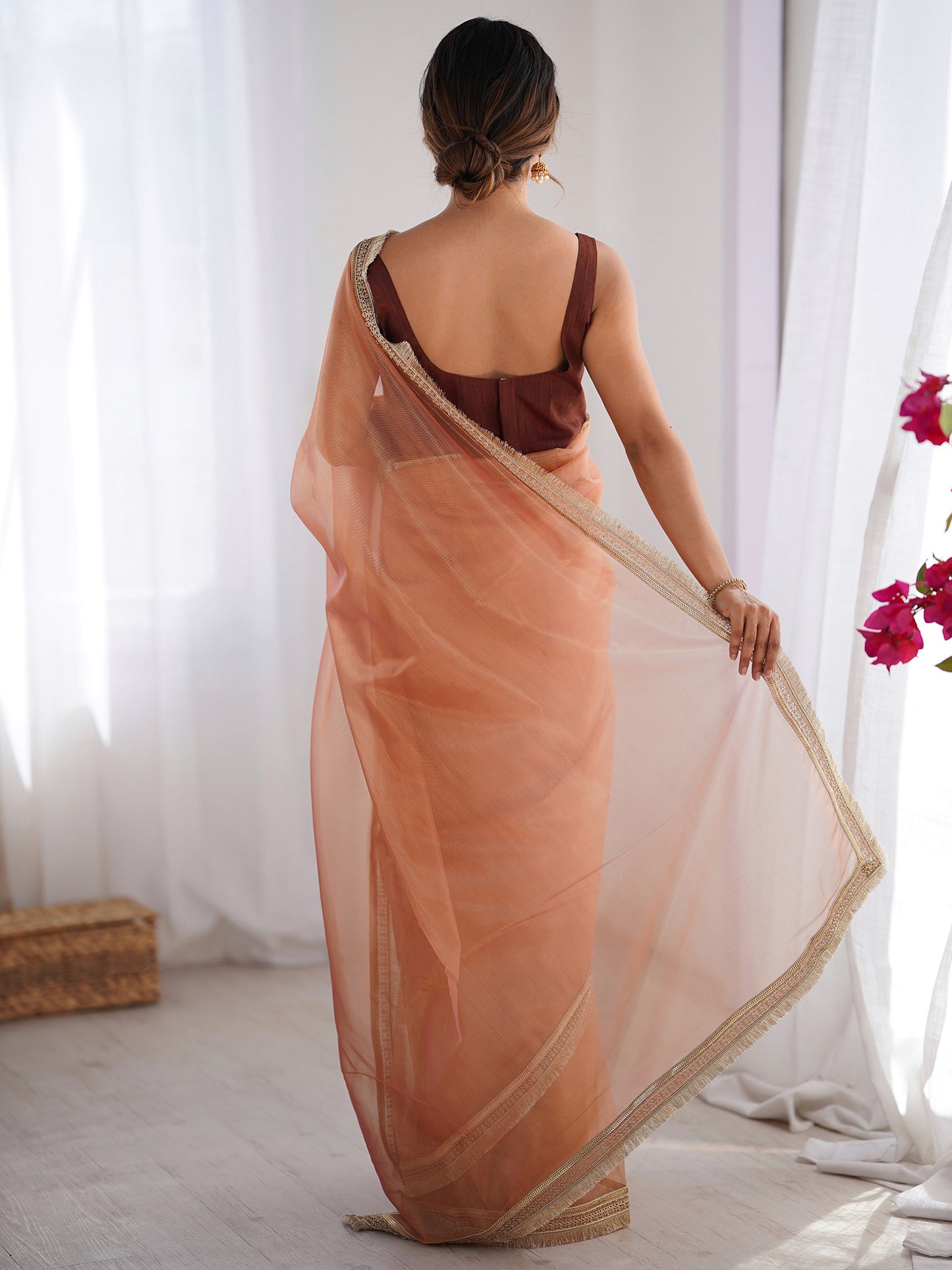 Women's Net Peach Embellished Designer Saree With Blouse Piece