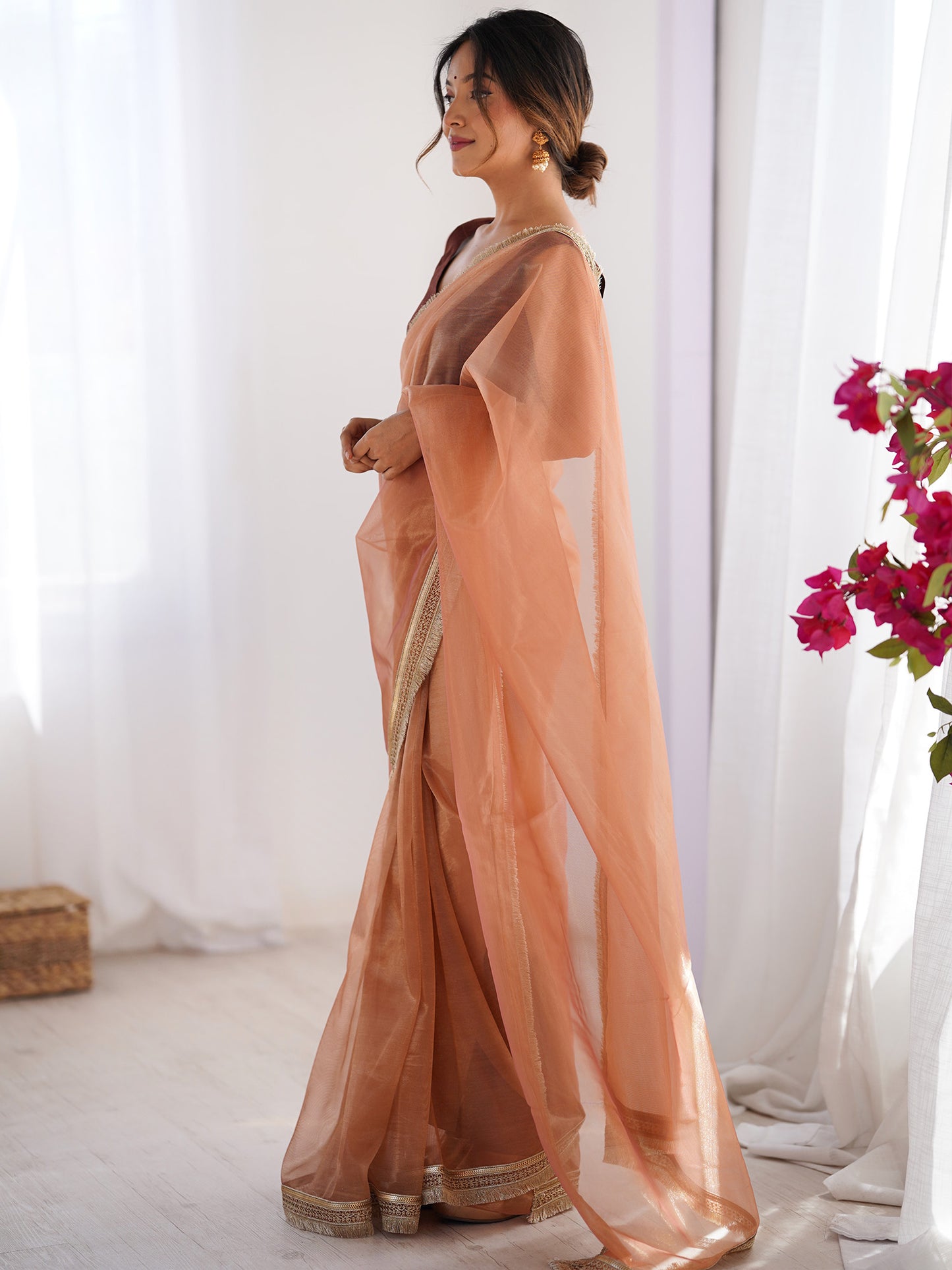 Women's Net Peach Embellished Designer Saree With Blouse Piece