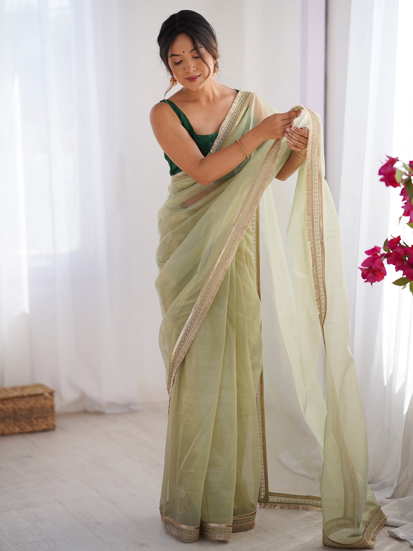 Women's Net Peach Embellished Designer Saree With Blouse Piece