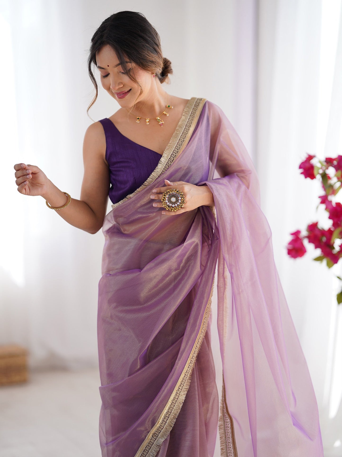 Women's Net Peach Embellished Designer Saree With Blouse Piece