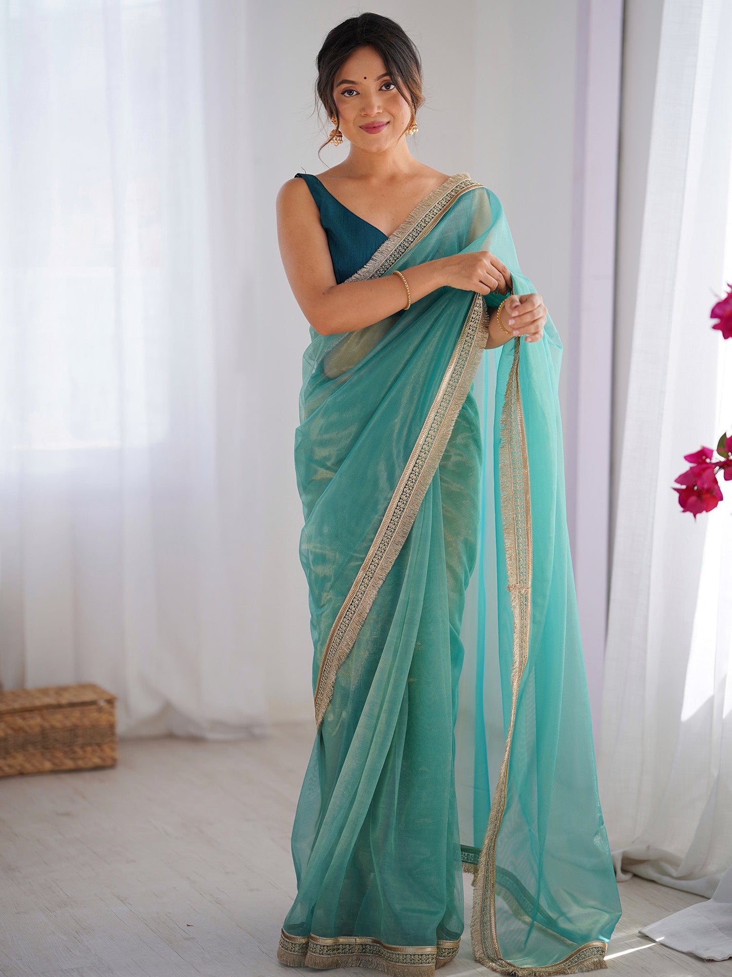 Women's Net Peach Embellished Designer Saree With Blouse Piece