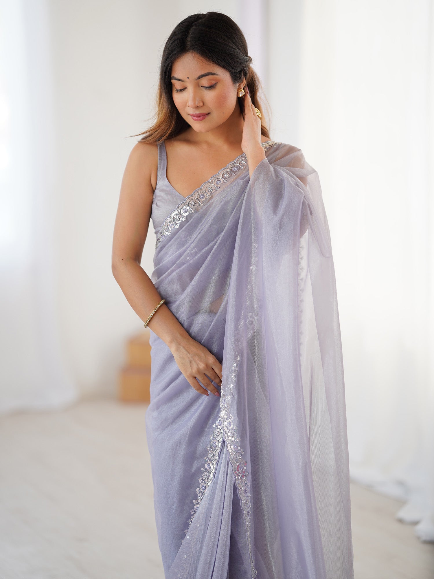 Women's Net Lavendar Embellished Designer Saree With Blouse Piece