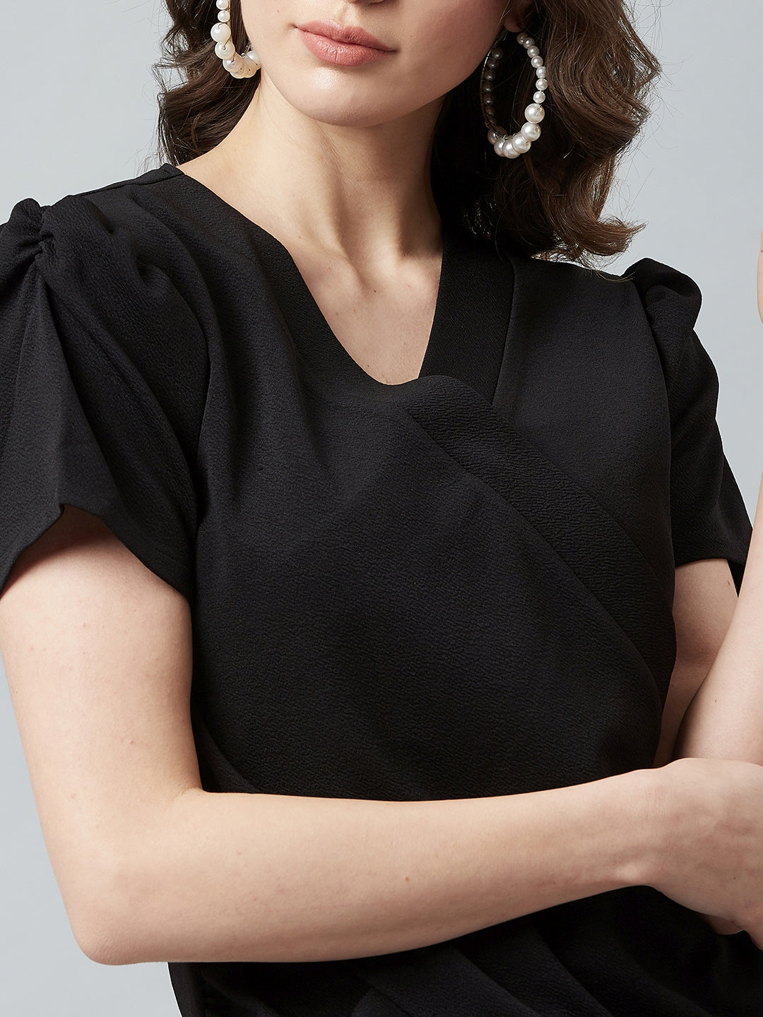 athena black wrap top with puffed sleeves