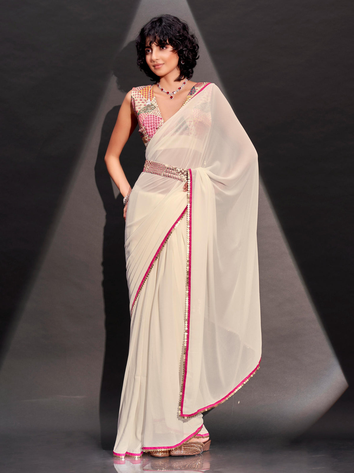 Cream solid georgette saree with embroidered blouse & belt