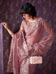 Pink colored shimmer net saree with jari embroidery scalloped border and faux diamonds