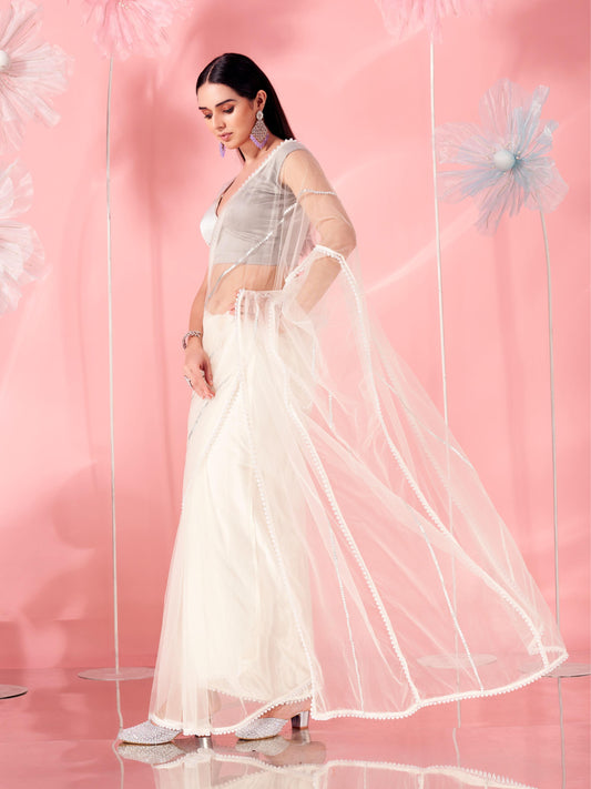Off white colored designer net saree with faux beads and pearls stitched on pallu