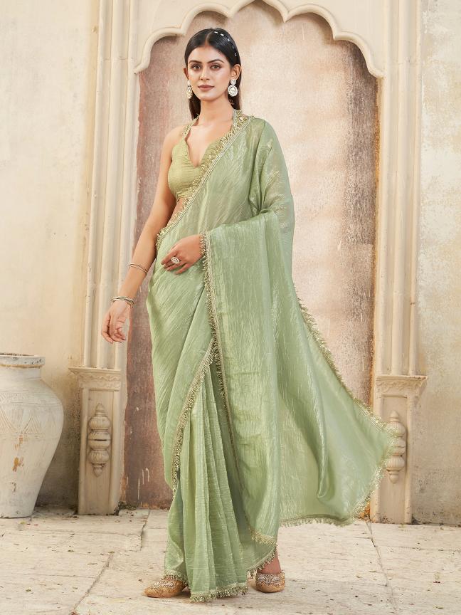 Pista green colored crunchy saree with sequinned lace and brocade blouse