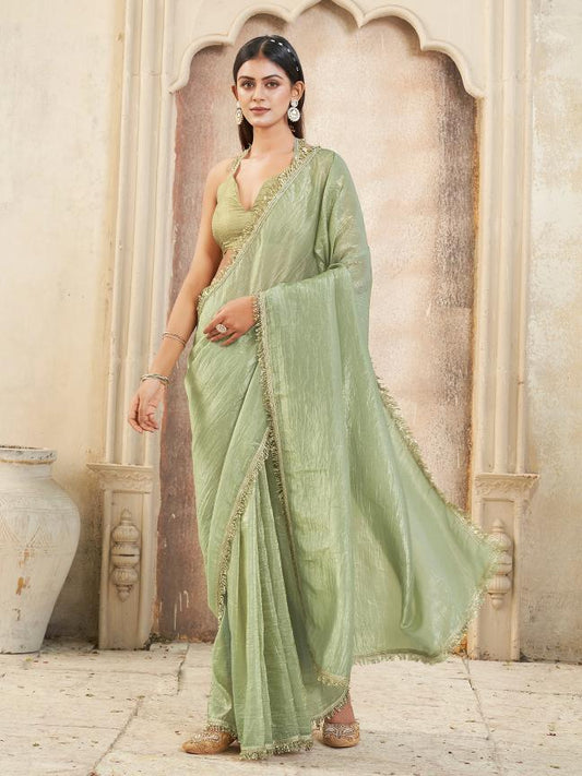 Pista green colored crunchy saree with sequinned lace and brocade blouse