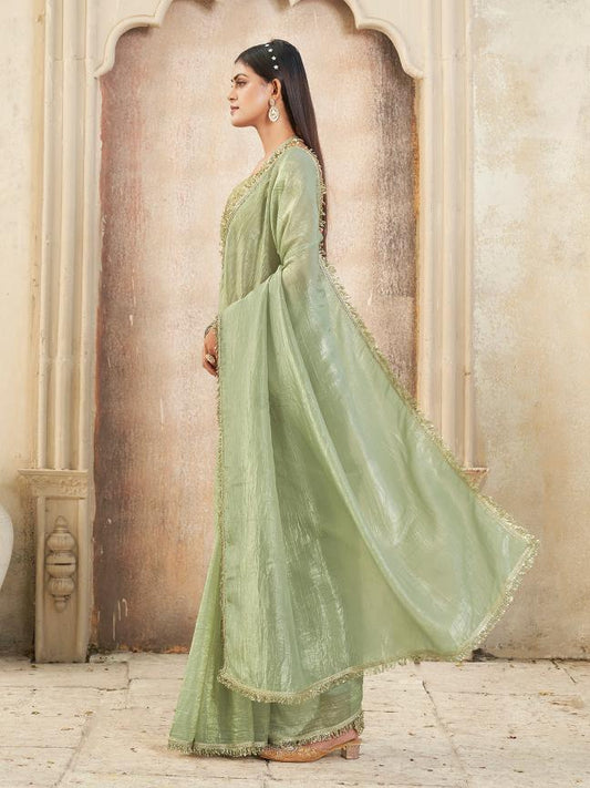 Pista green colored crunchy saree with sequinned lace and brocade blouse