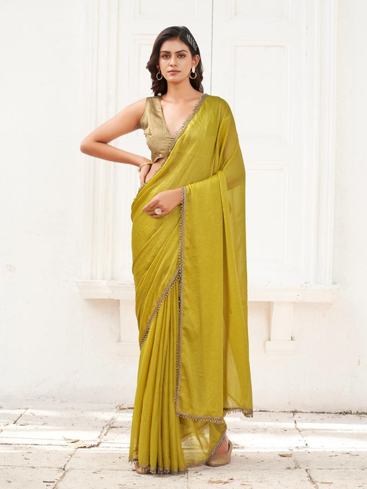 Mustard colored saree with embellished lace