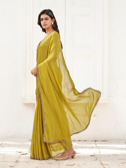 Mustard colored saree with embellished lace