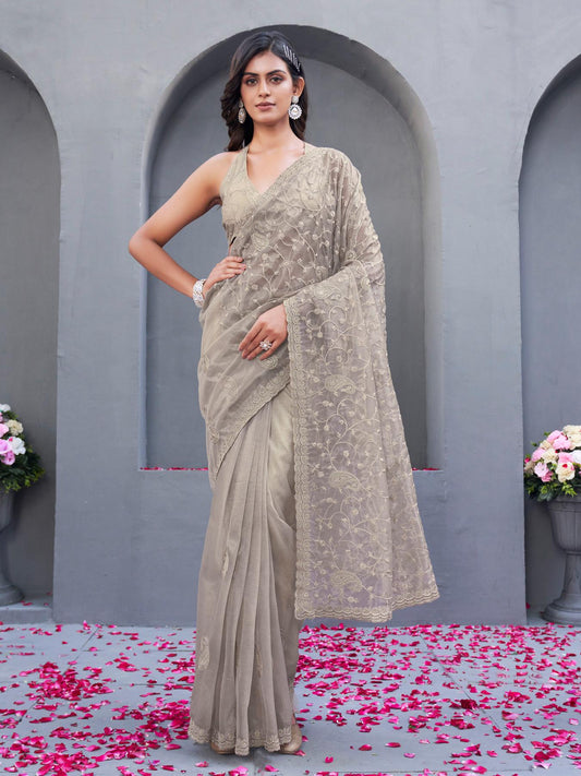 Beige colored shimmer net embroidered designer saree