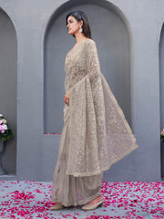 Beige colored shimmer net embroidered designer saree