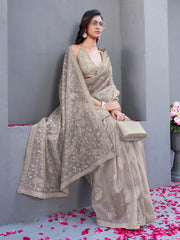 Beige colored shimmer net embroidered designer saree