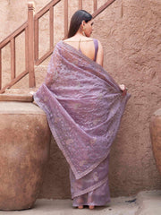 Beige colored shimmer net embroidered designer saree
