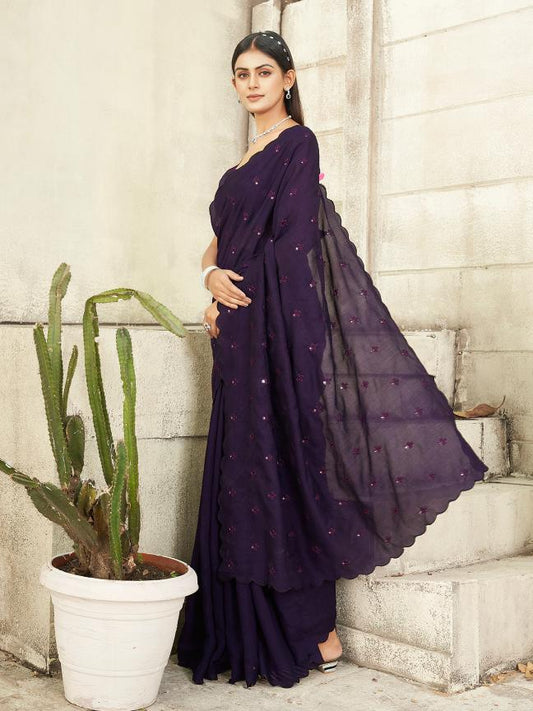 purple colored saree with mirror embroidery on pallu and scalloped border