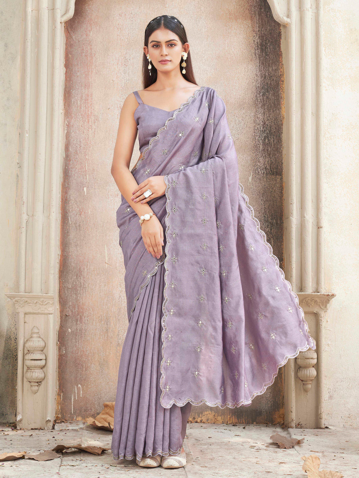 mauve colored saree with mirror embroidery on pallu and scalloped border