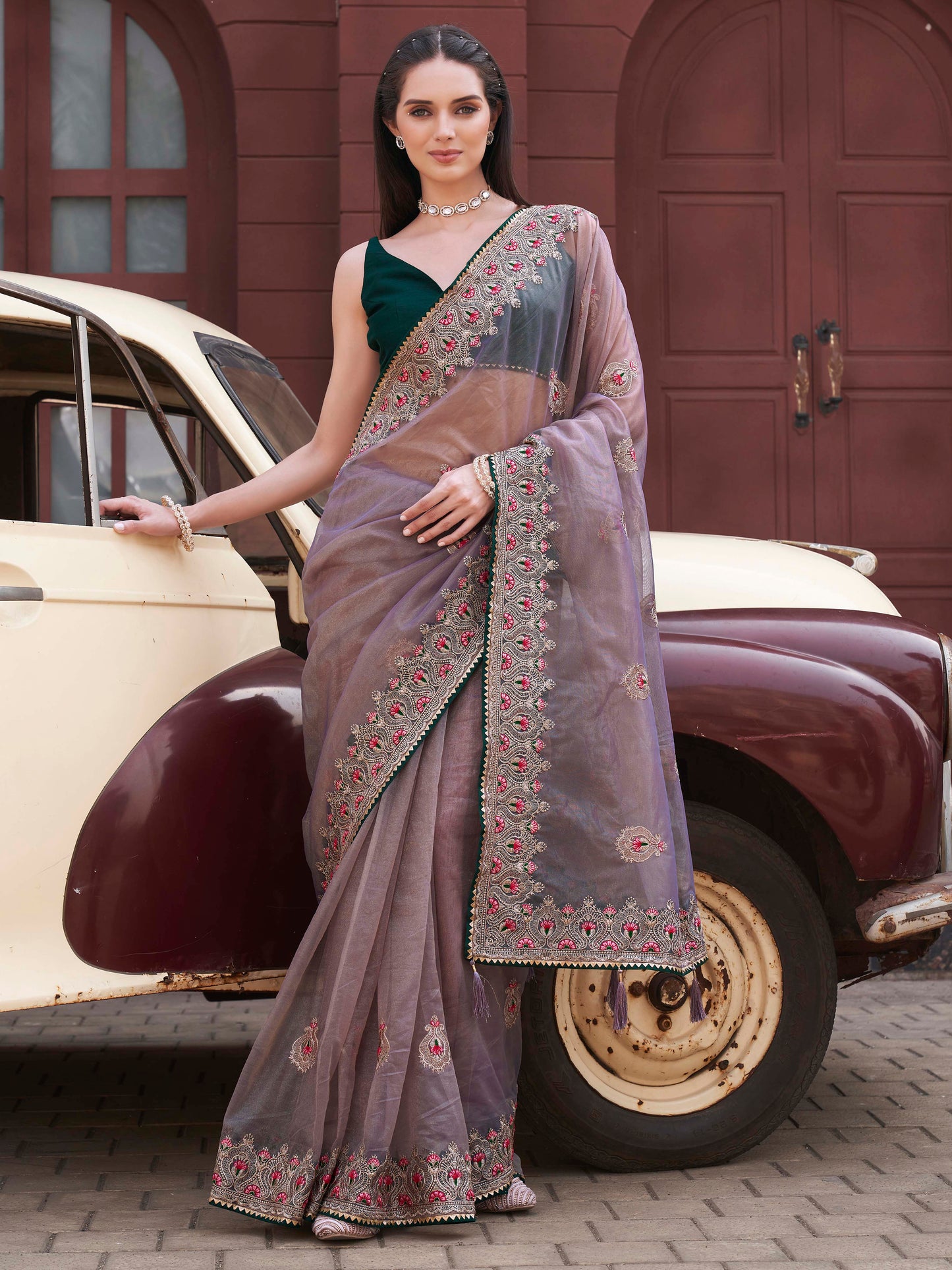 Green colored shimmer net embroidered saree
