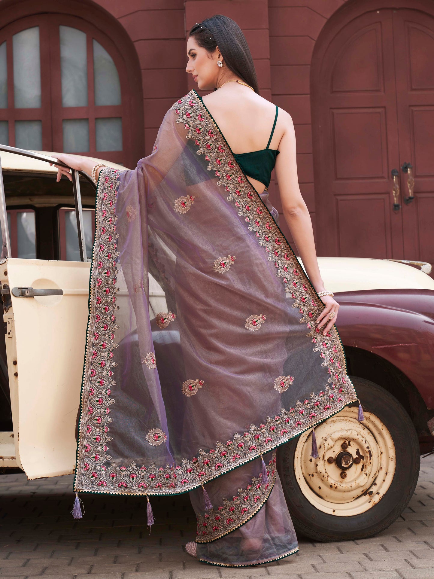 Green colored shimmer net embroidered saree