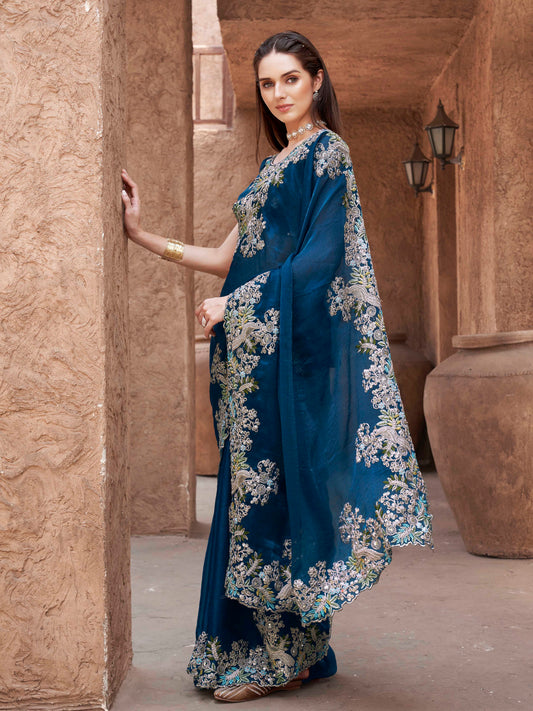 teal colored designer jimmy choo saree with sequinned embroidery border