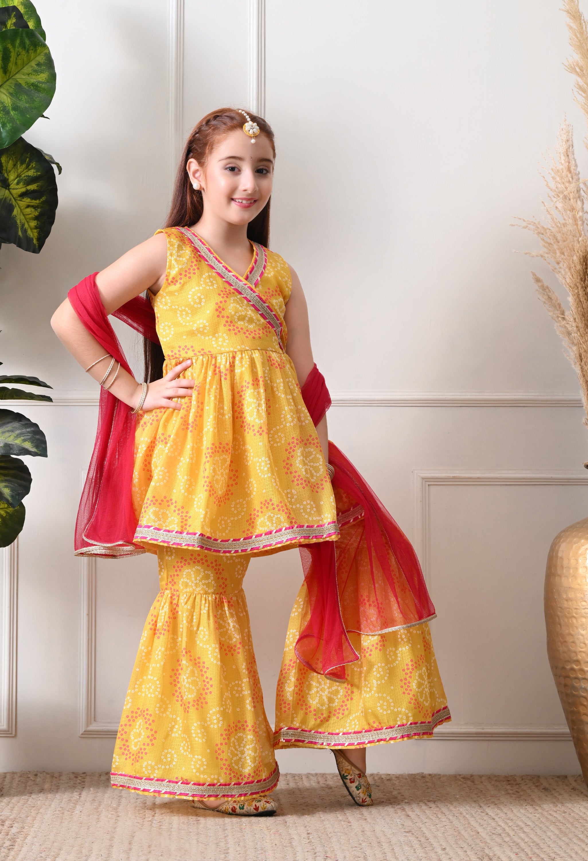 Girl's Yellow Bandhani Print Sleeveless Kurta Sharara Set with Dupatta