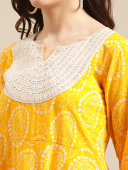 Kalini Women Mustard And White Bandhej Printed Flared Kurta Sharara Set With Net Embroidered Dupatta.
