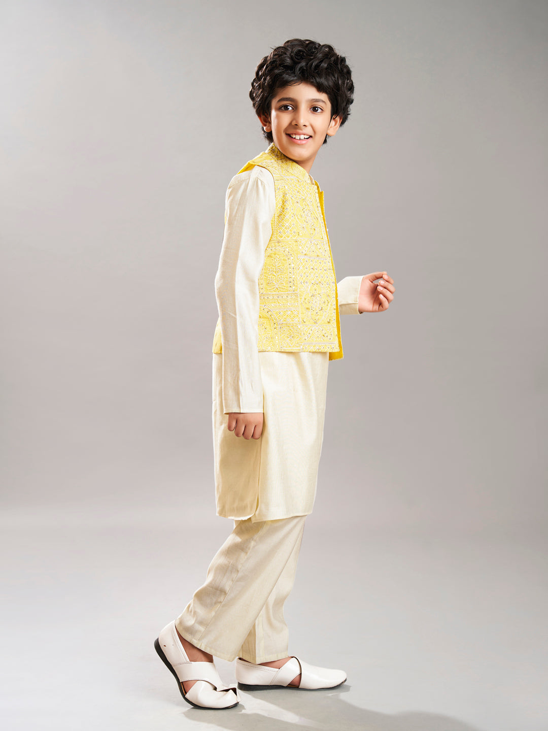 Boys off white kurta pajama with yellow modal booti jacket