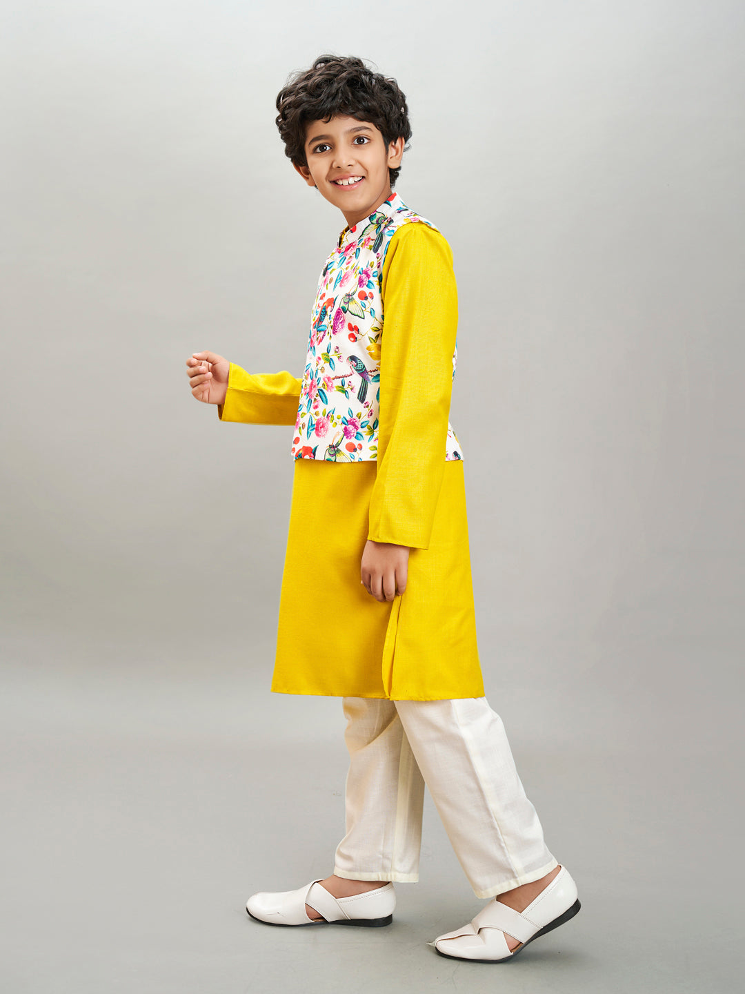 Boys yellow kurta & off white pajama with a multi print jacket
