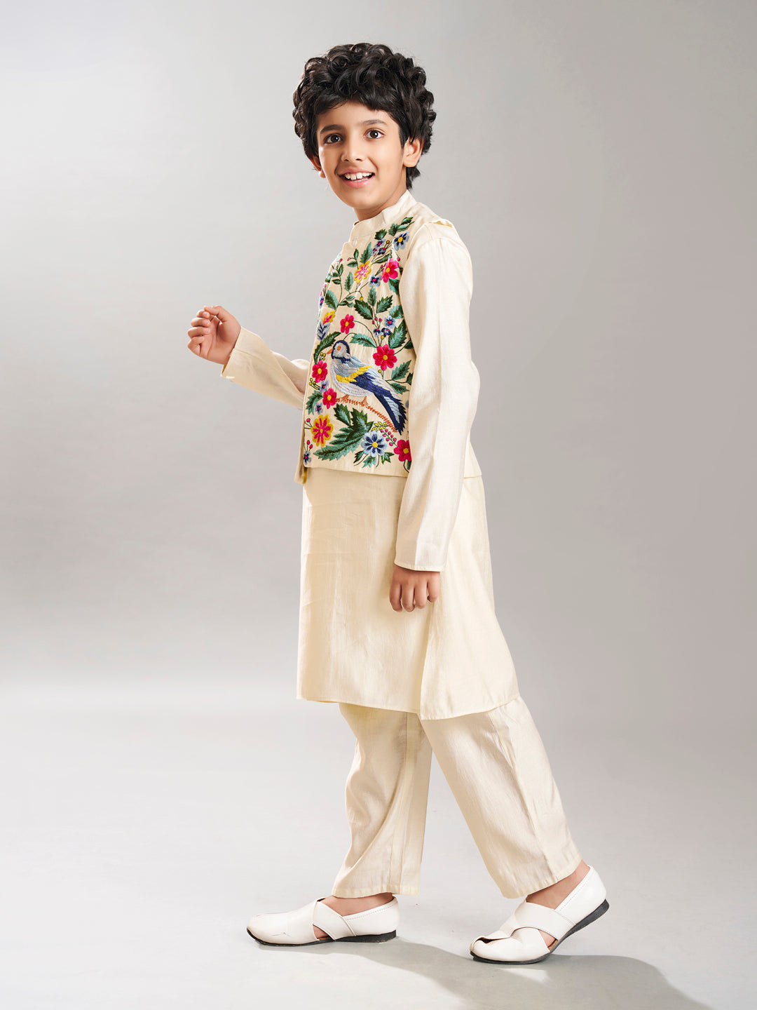 Boys off white kurta pajama with a off white embroidry jacket