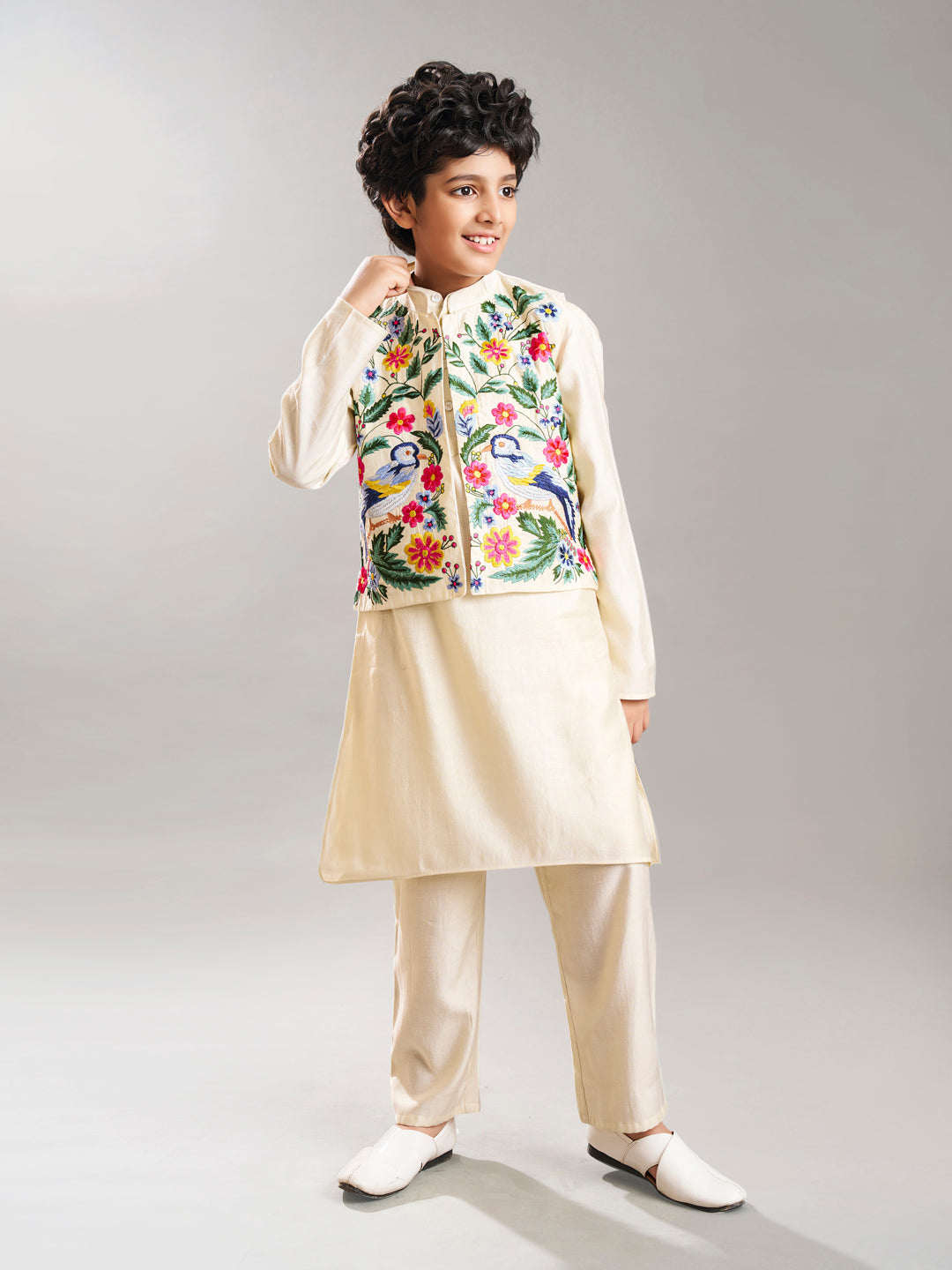 Boys off white kurta pajama with a off white embroidry jacket