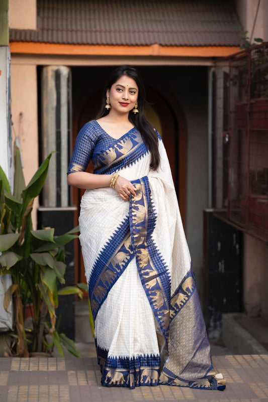 sift silk saree with zari woven chex and with elephant border and rich pallu.Cotton tasslels on pallu.
