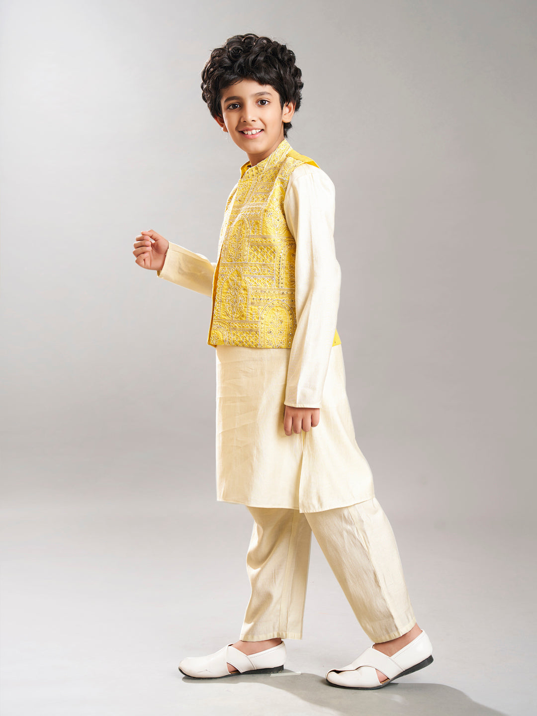 Boys off white kurta pajama with yellow modal booti jacket