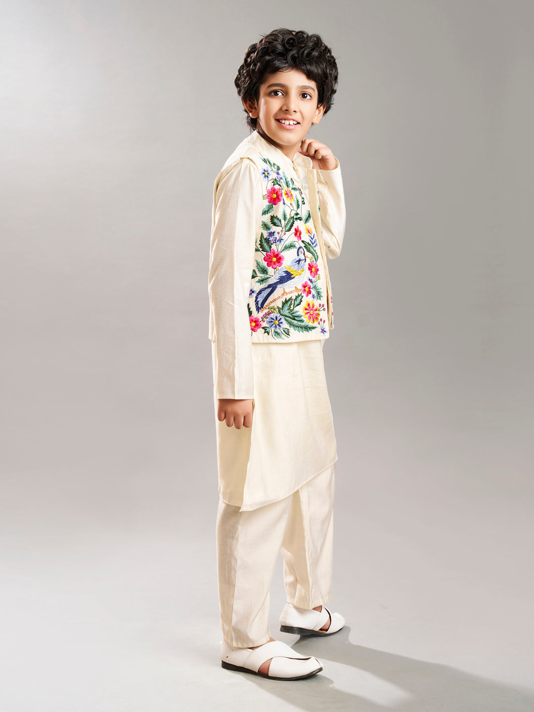 Boys off white kurta pajama with a off white embroidry jacket