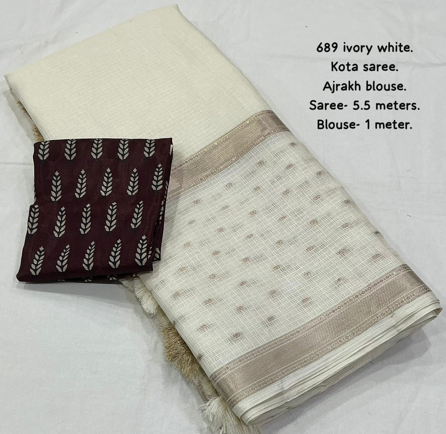 soft kota saree with zari woven zig zag border.cotton tassels on pallu.contrast zari woven banarasi silk blouse