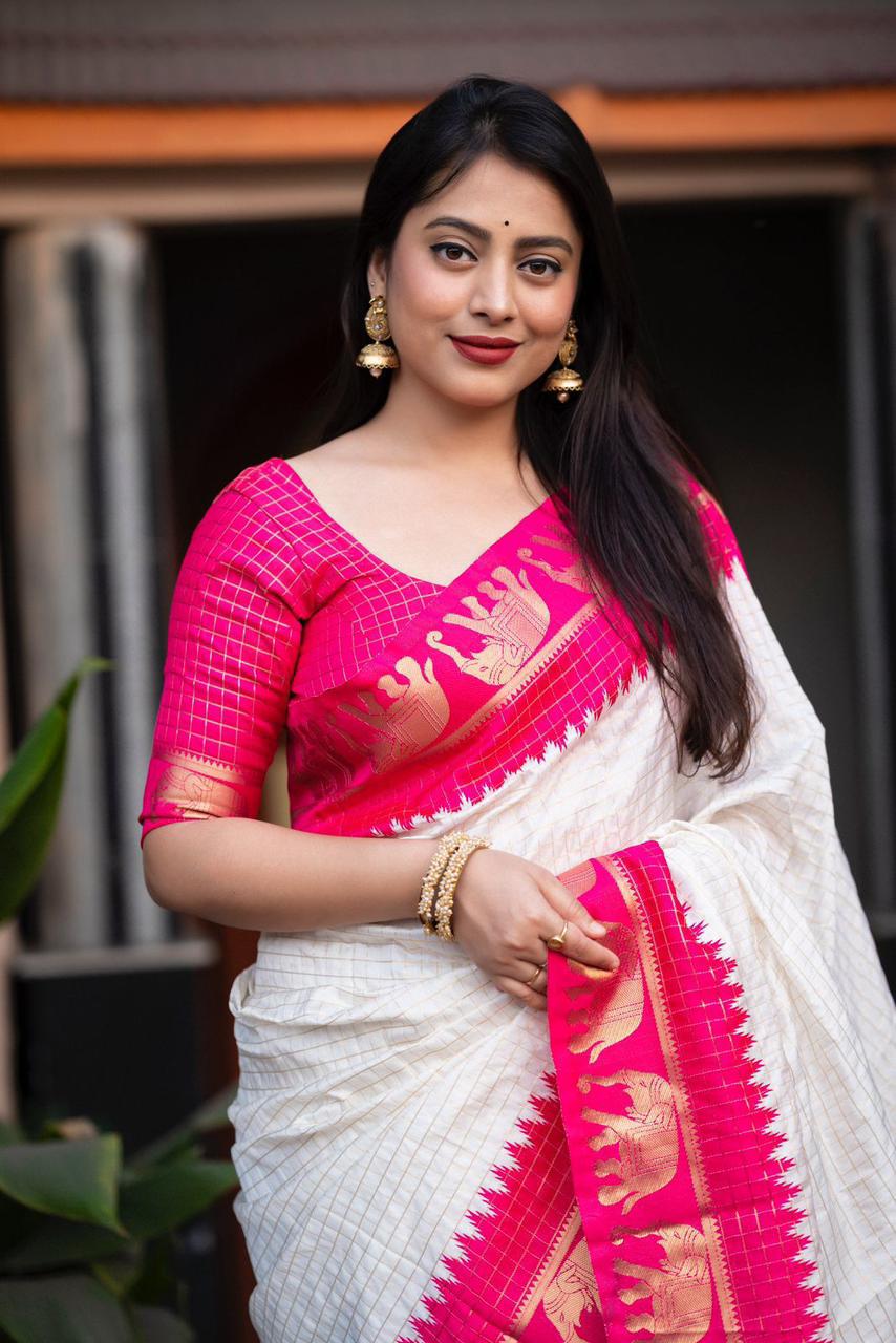 sift silk saree with zari woven chex and with elephant border and rich pallu.Cotton tasslels on pallu.