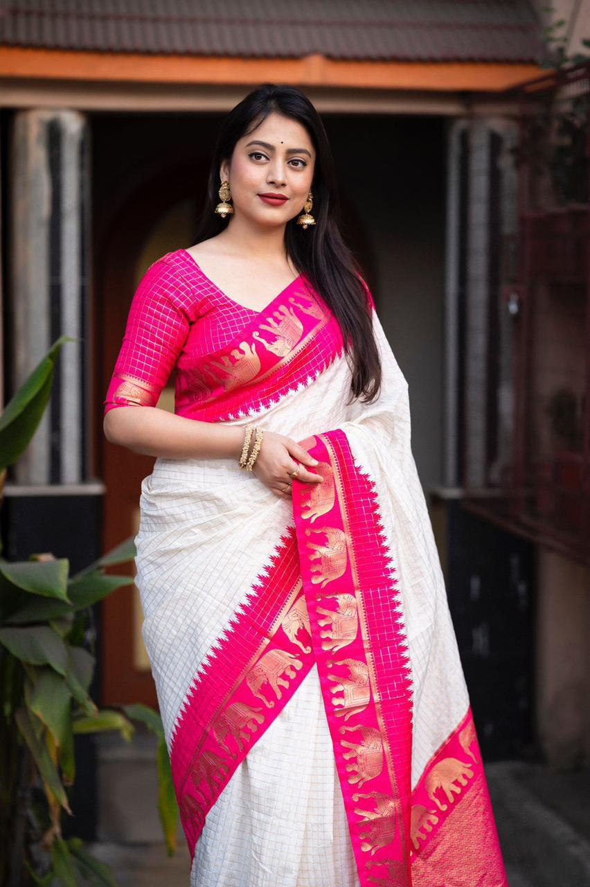 sift silk saree with zari woven chex and with elephant border and rich pallu.Cotton tasslels on pallu.
