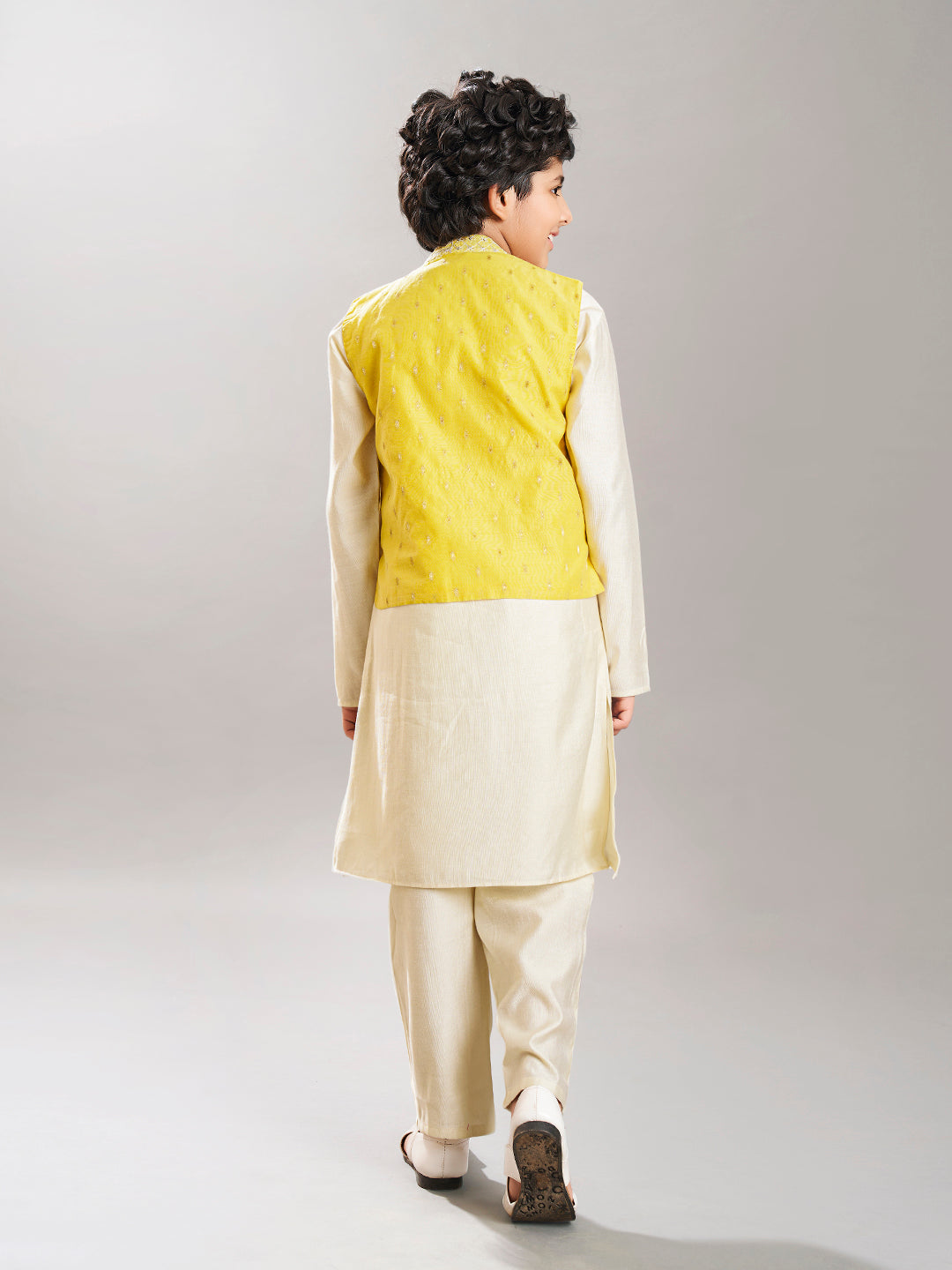 Boys off white kurta pajama with yellow modal booti jacket