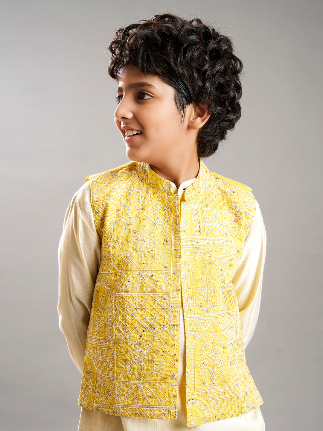 Boys off white kurta pajama with yellow modal booti jacket
