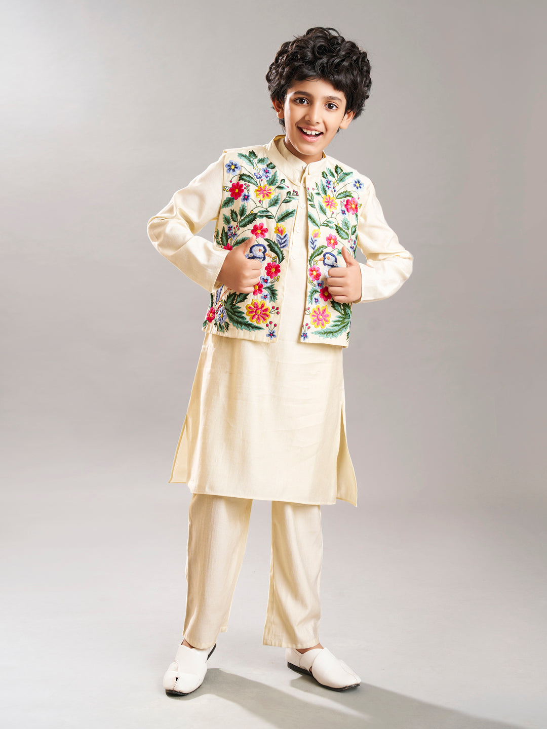 Boys off white kurta pajama with a off white embroidry jacket